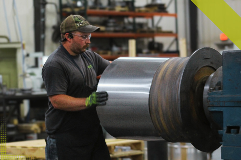 Employee hand spinning metal