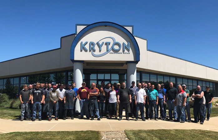 KRYTON team in front of building